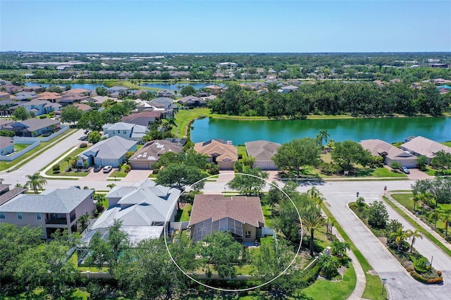 6605 38th Ln E, Sarasota, FL 34243 - aerial perspective of suburban area featuring a large body of water and a tree filled landscape