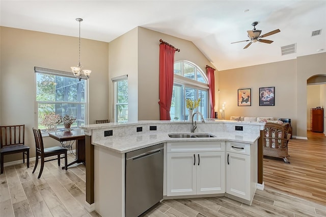 6605 38th Ln E, Sarasota, FL 34243 - kitchen with dishwasher, a sink, open floor plan, healthy amount of natural light, and vaulted ceiling