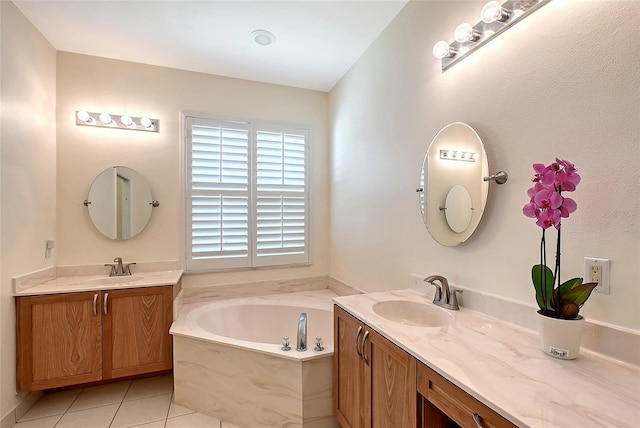 6605 38th Ln E, Sarasota, FL 34243 - bathroom with two vanities, a garden tub, and tile patterned floors