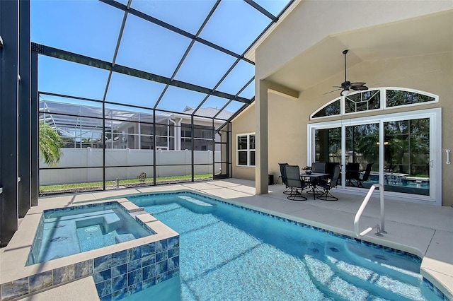 6605 38th Ln E, Sarasota, FL 34243 - view of pool featuring a patio, ceiling fan, glass enclosure, and a pool with connected hot tub