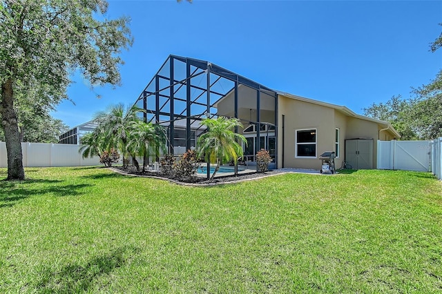 6605 38th Ln E, Sarasota, FL 34243 - rear view of house featuring stucco siding, a gate, a patio, a lanai, and an outdoor pool