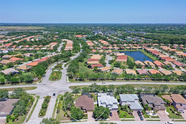 6605 38th Ln E, Sarasota, FL 34243 - aerial view of property and surrounding area with nearby suburban area and a large body of water