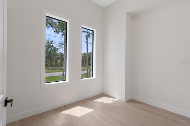 117 Marker Rd, Rotonda West, FL 33947 - unfurnished room with baseboards and light wood finished floors