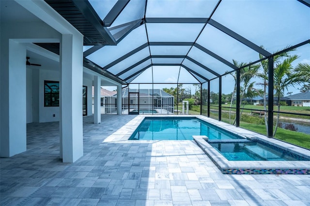 117 Marker Rd, Rotonda West, FL 33947 - view of pool featuring a pool with connected hot tub, a patio, and glass enclosure