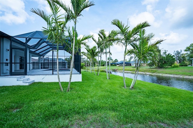 117 Marker Rd, Rotonda West, FL 33947 - view of grassy yard with a water view and glass enclosure