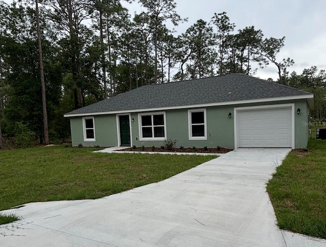 ranch-style house with stucco siding, concrete driveway, an attached garage, and a front yard