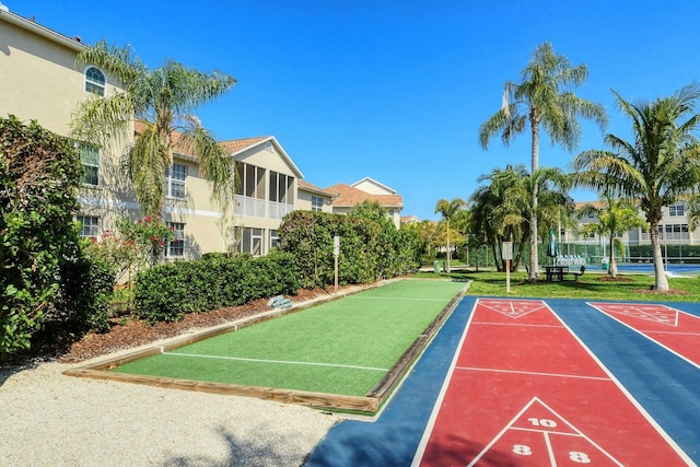 view of property's community featuring shuffleboard and a bocce ball area