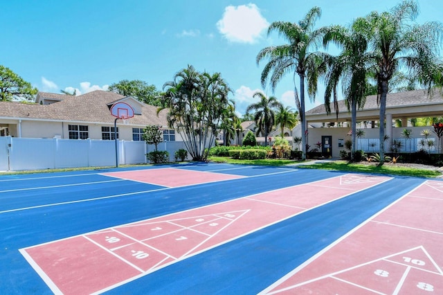 surrounding community featuring fence and shuffleboard