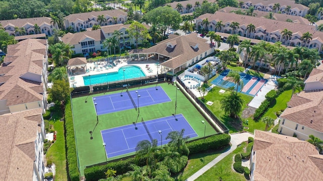 aerial perspective of suburban area featuring a pool area