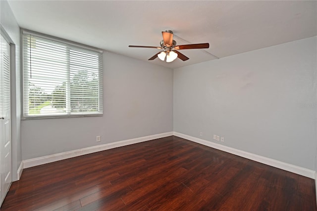 2901 26th St W Unit 312, Bradenton, FL 34205 - empty room featuring a ceiling fan, dark wood finished floors, and baseboards