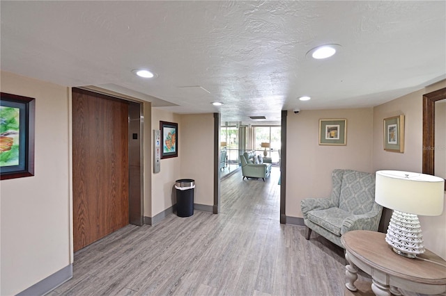 2901 26th St W Unit 312, Bradenton, FL 34205 - hallway featuring baseboards, light wood finished floors, and recessed lighting