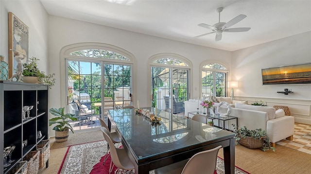 33 Bishops Court Rd Unit 118, Osprey, FL 34229 - dining area with a ceiling fan and wainscoting