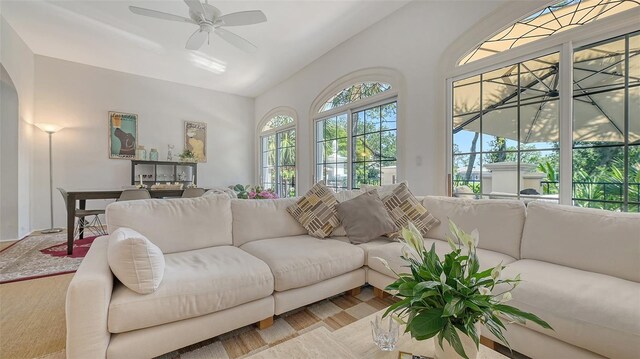 33 Bishops Court Rd Unit 118, Osprey, FL 34229 - living area featuring a ceiling fan and arched walkways
