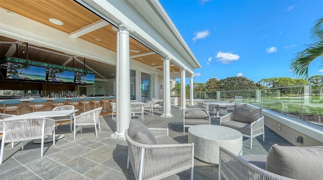33 Bishops Court Rd Unit 118, Osprey, FL 34229 - view of patio featuring exterior bar