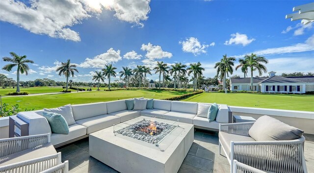 33 Bishops Court Rd Unit 118, Osprey, FL 34229 - view of patio with an outdoor living space with a fire pit and view of golf course