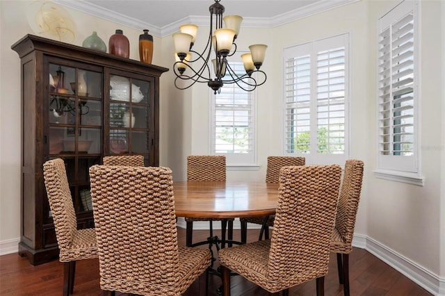 dining room with a chandelier, dark wood-type flooring, baseboards, and ornamental molding