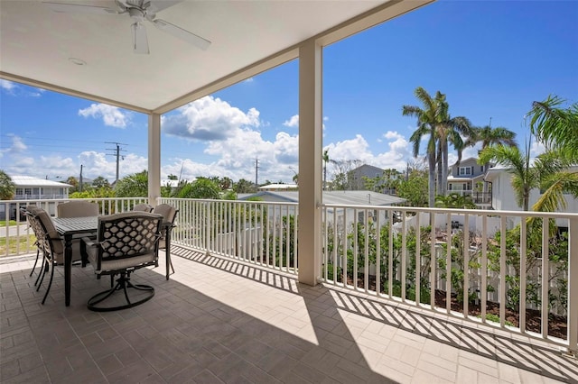 view of patio / terrace with a ceiling fan, outdoor dining area, and a balcony