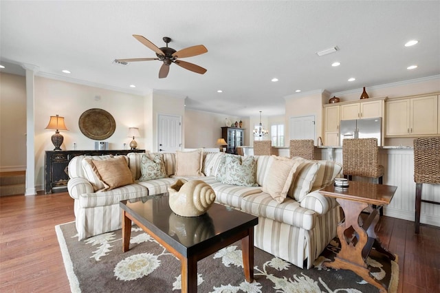 living room featuring ornamental molding, ceiling fan, recessed lighting, light wood-style flooring, and baseboards