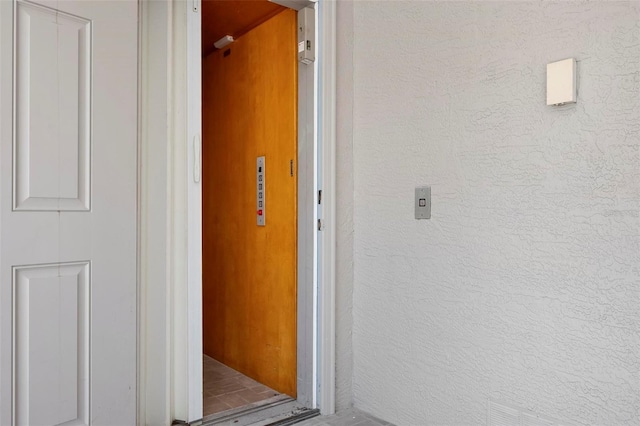 hallway with a textured wall