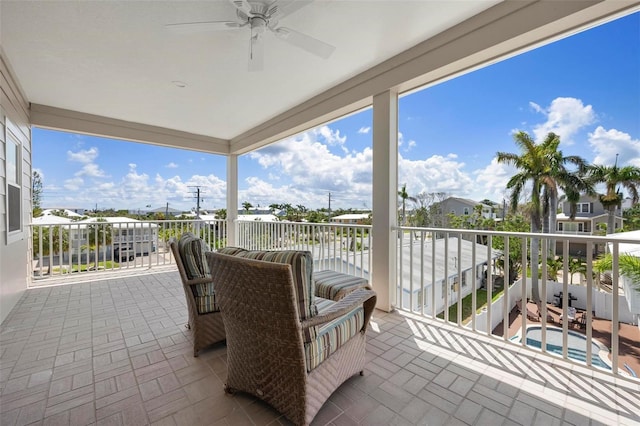 view of patio / terrace with a balcony and ceiling fan