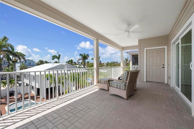 sunroom with a ceiling fan