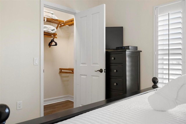 bedroom with wood finished floors