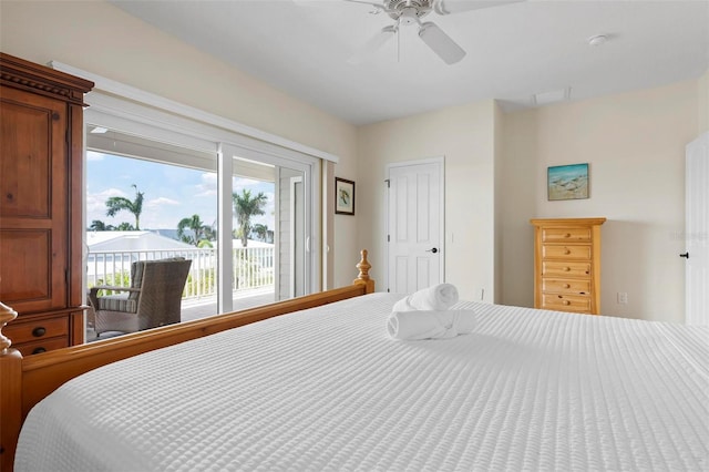 bedroom with access to outside and ceiling fan