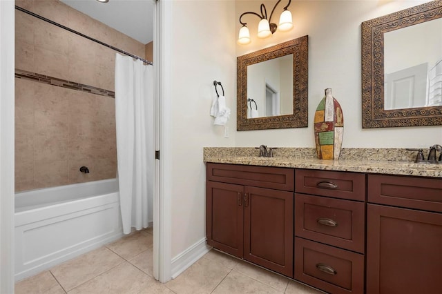 bathroom with tile patterned floors, double vanity, and shower / bath combo