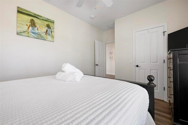 bedroom featuring dark wood-style flooring and ceiling fan