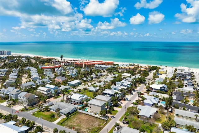 aerial view of residential area featuring a large body of water