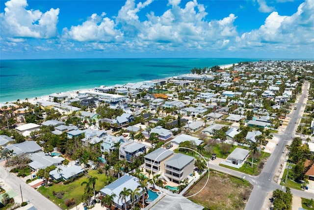 aerial view of residential area with a large body of water