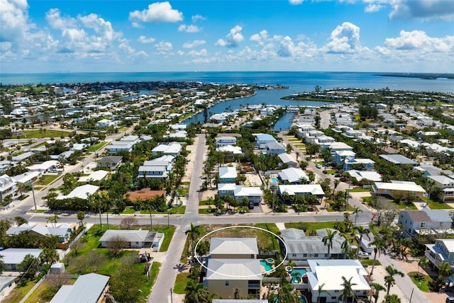 aerial perspective of suburban area with a nearby body of water