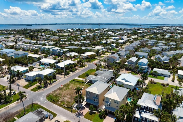 aerial view of residential area with a nearby body of water