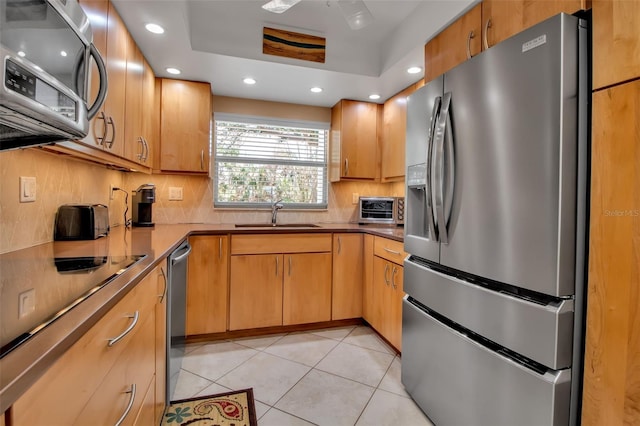 10423 Waterbird Way Unit 10423, Bradenton, FL 34209 - kitchen with stainless steel appliances, a sink, backsplash, light tile patterned flooring, and recessed lighting
