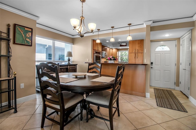 10423 Waterbird Way Unit 10423, Bradenton, FL 34209 - dining space with light tile patterned floors, ornamental molding, plenty of natural light, and a chandelier