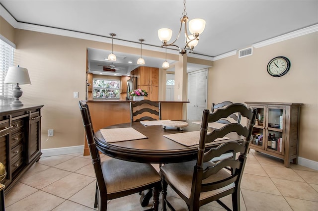 10423 Waterbird Way Unit 10423, Bradenton, FL 34209 - dining area with light tile patterned flooring, baseboards, crown molding, and a chandelier