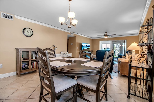 10423 Waterbird Way Unit 10423, Bradenton, FL 34209 - dining space featuring ornamental molding, light tile patterned flooring, a chandelier, a ceiling fan, and baseboards