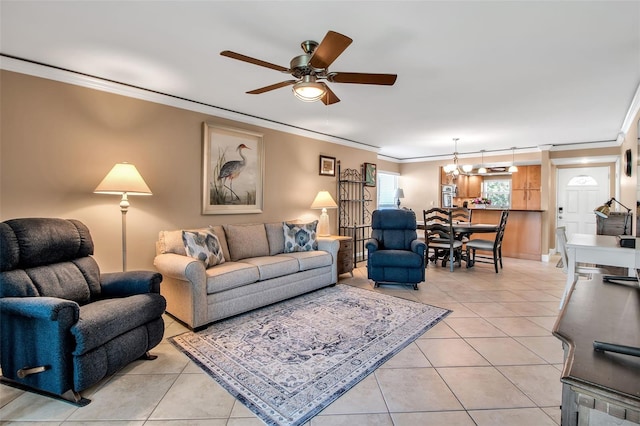 10423 Waterbird Way Unit 10423, Bradenton, FL 34209 - living area with crown molding, a ceiling fan, light tile patterned flooring, a chandelier, and baseboards