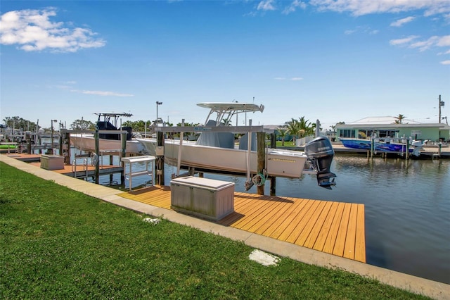 10423 Waterbird Way Unit 10423, Bradenton, FL 34209 - dock area featuring boat lift, a water view, and a lawn