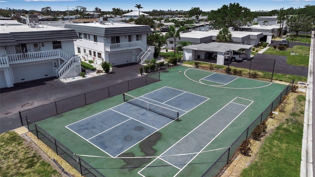 10423 Waterbird Way Unit 10423, Bradenton, FL 34209 - view of basketball court featuring fence, a residential view, and a tennis court