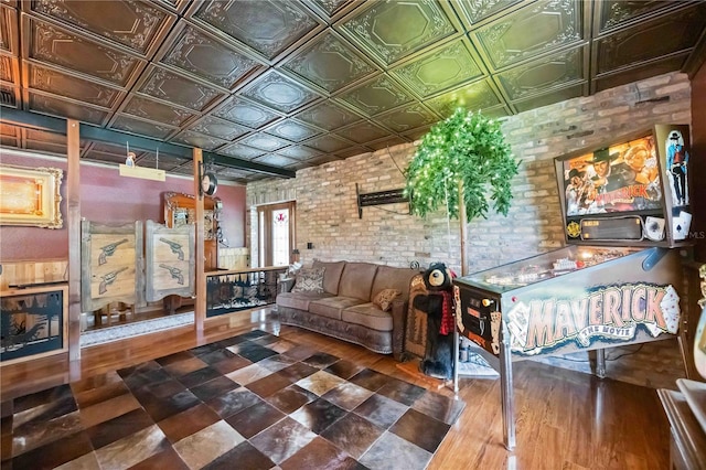 4225 Ulman Ave, North Port, FL 34286 - living room featuring brick wall, an ornate ceiling, and wood finished floors