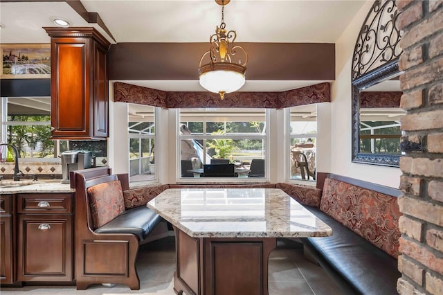 4225 Ulman Ave, North Port, FL 34286 - dining room with breakfast area, healthy amount of natural light, and light tile patterned floors