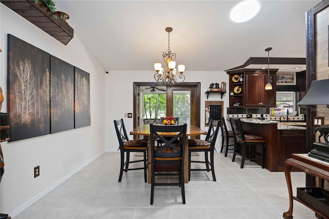 4225 Ulman Ave, North Port, FL 34286 - dining area with a chandelier, plenty of natural light, baseboards, and light tile patterned floors