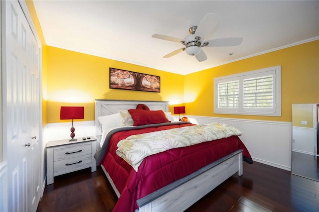 4225 Ulman Ave, North Port, FL 34286 - bedroom with wainscoting, dark wood-style floors, ornamental molding, and ceiling fan