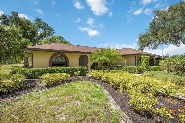 4225 Ulman Ave, North Port, FL 34286 - mediterranean / spanish house featuring stucco siding