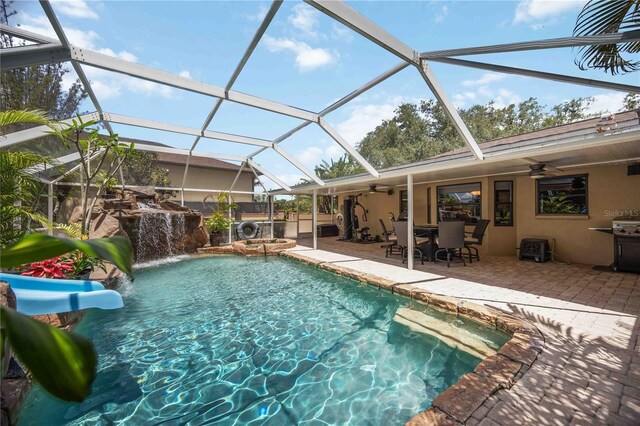 4225 Ulman Ave, North Port, FL 34286 - view of swimming pool featuring ceiling fan, a patio, a pool with connected hot tub, outdoor dining space, and a grill