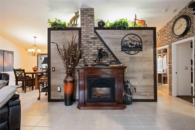 4225 Ulman Ave, North Port, FL 34286 - living room with tile patterned flooring, a chandelier, and a glass covered fireplace