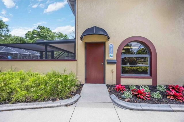 4225 Ulman Ave, North Port, FL 34286 - view of exterior entry featuring stucco siding