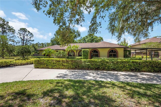 4225 Ulman Ave, North Port, FL 34286 - ranch-style house featuring stucco siding