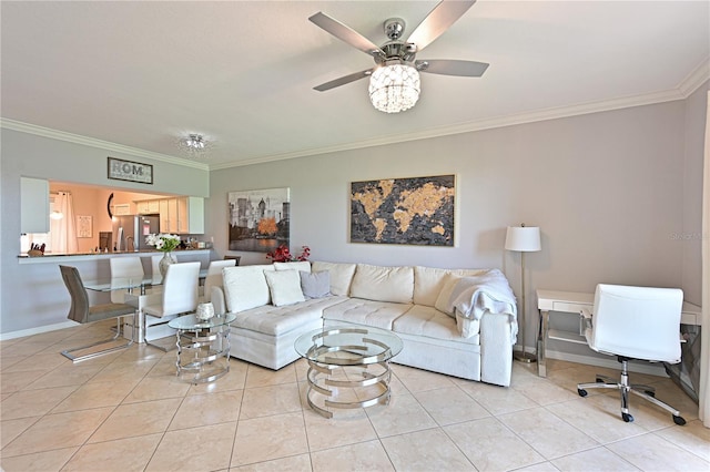 living area featuring light tile patterned floors, ornamental molding, ceiling fan, and baseboards